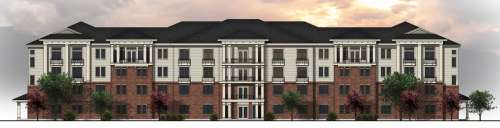 Four-story Ivory University House Salt Lake City apartment building with a brick facade on the lower levels, white siding on the upper stories, black roof, balconies, and trees out front, set against a cloudy sunset sky.